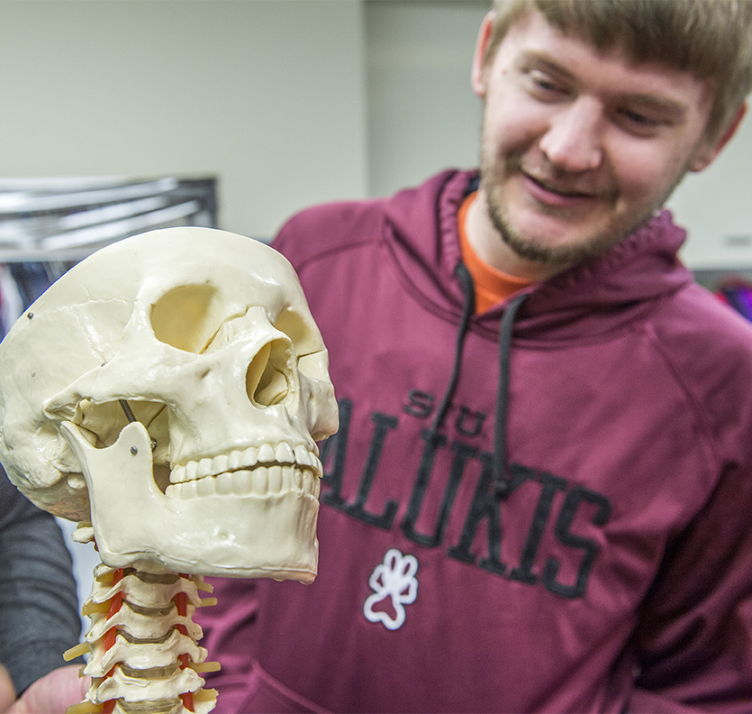 SIU Radiologic Sciences student with skeleton